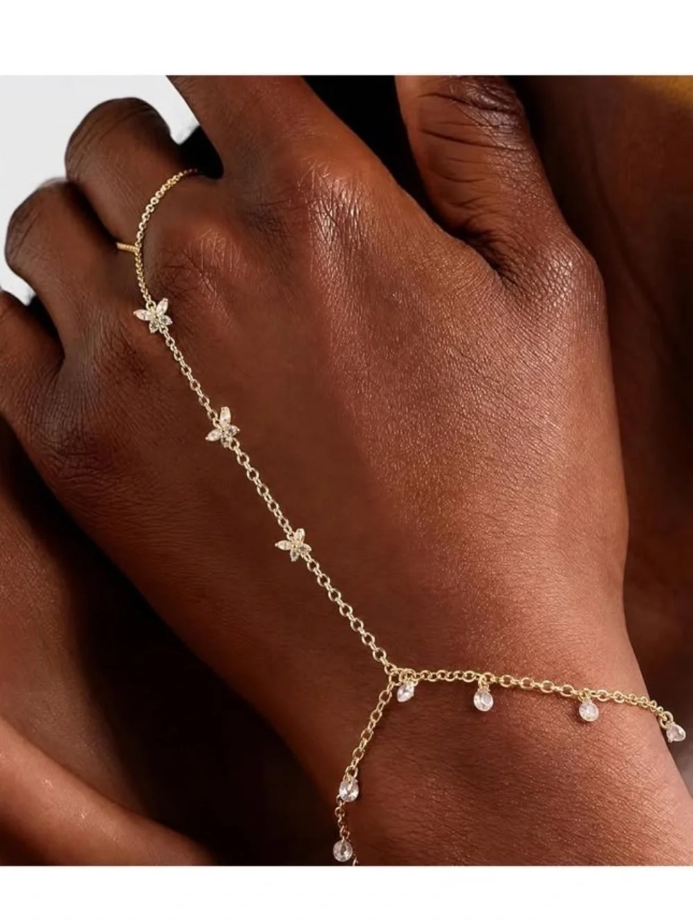 Anthropologie Gold Tone Floral Hand Chain with Clear Drops